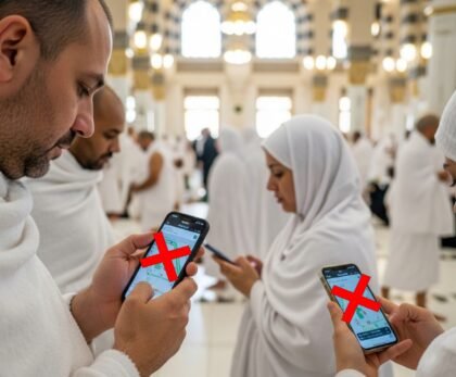 Pilgrims in Ihram using smartphones with red X marks over the screens, indicating mobile distractions are discouraged during Hajj and Umrah.